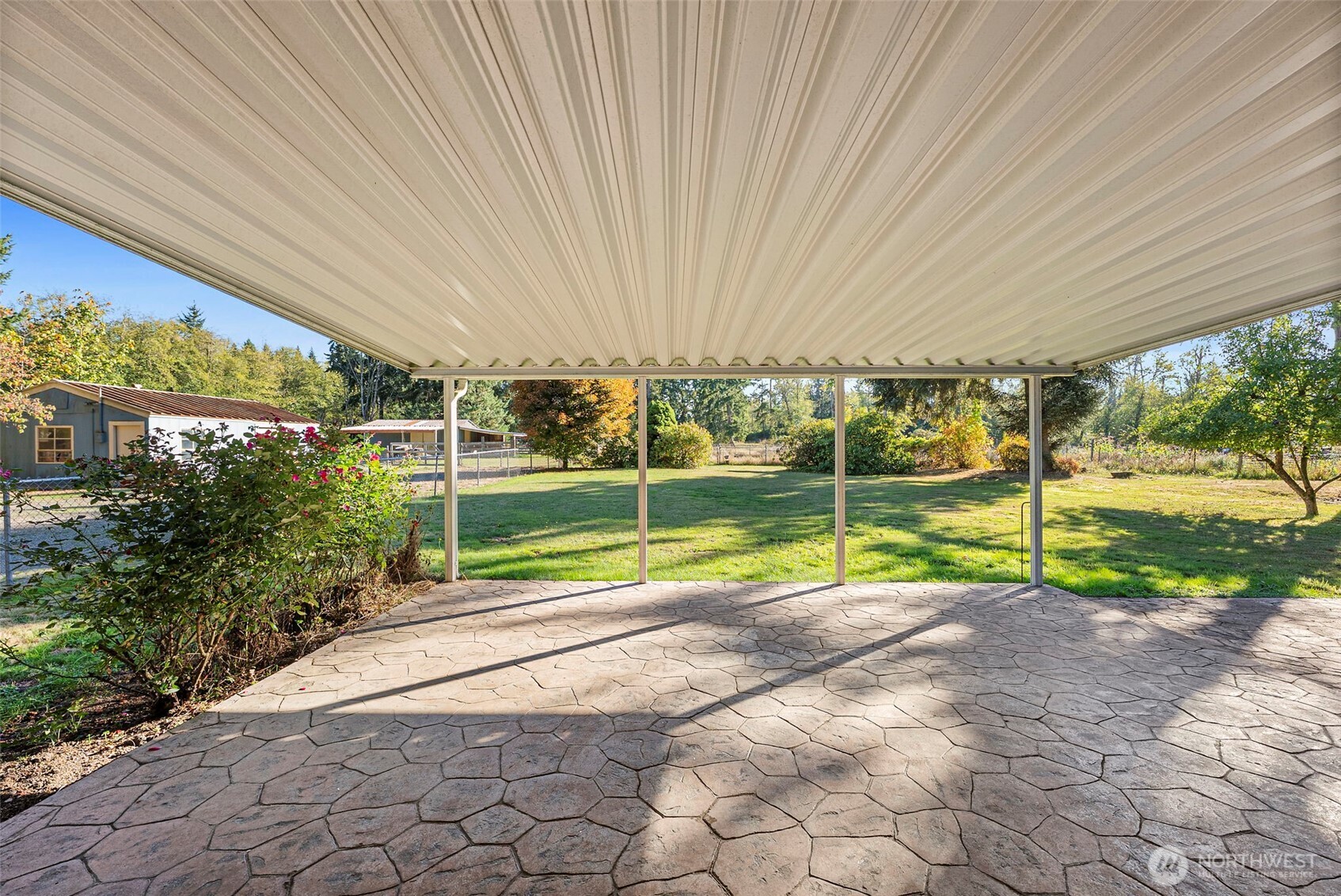 8112 266th Street East Graham, WA 98338 - Photo 25 of 40 a view of a backyard with plants and a backyard