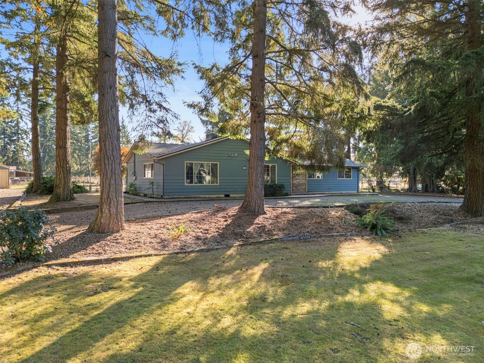 8112 266th Street East Graham, WA 98338 - Photo 38 of 40 a view of a house with backyard and trees