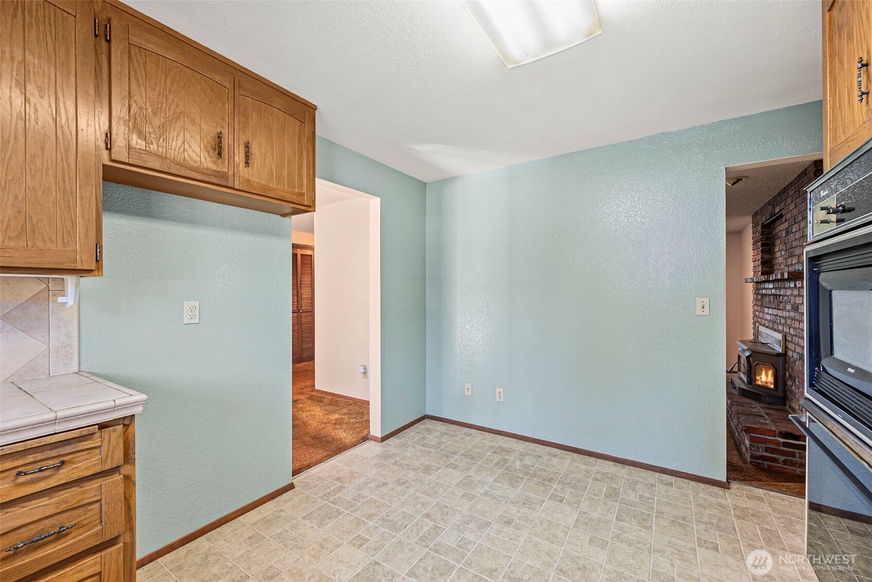 8112 266th Street East Graham, WA 98338 - Photo 8 of 40 a view of an empty room and fire place