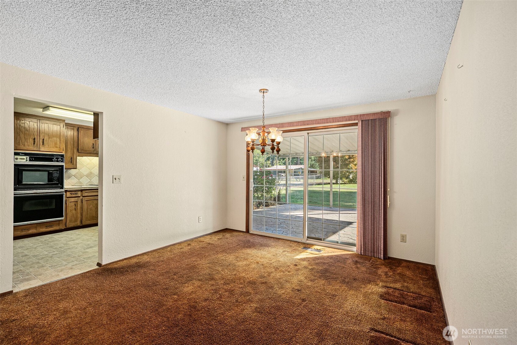 8112 266th Street East Graham, WA 98338 - Photo 9 of 40 a view of an empty room with a window