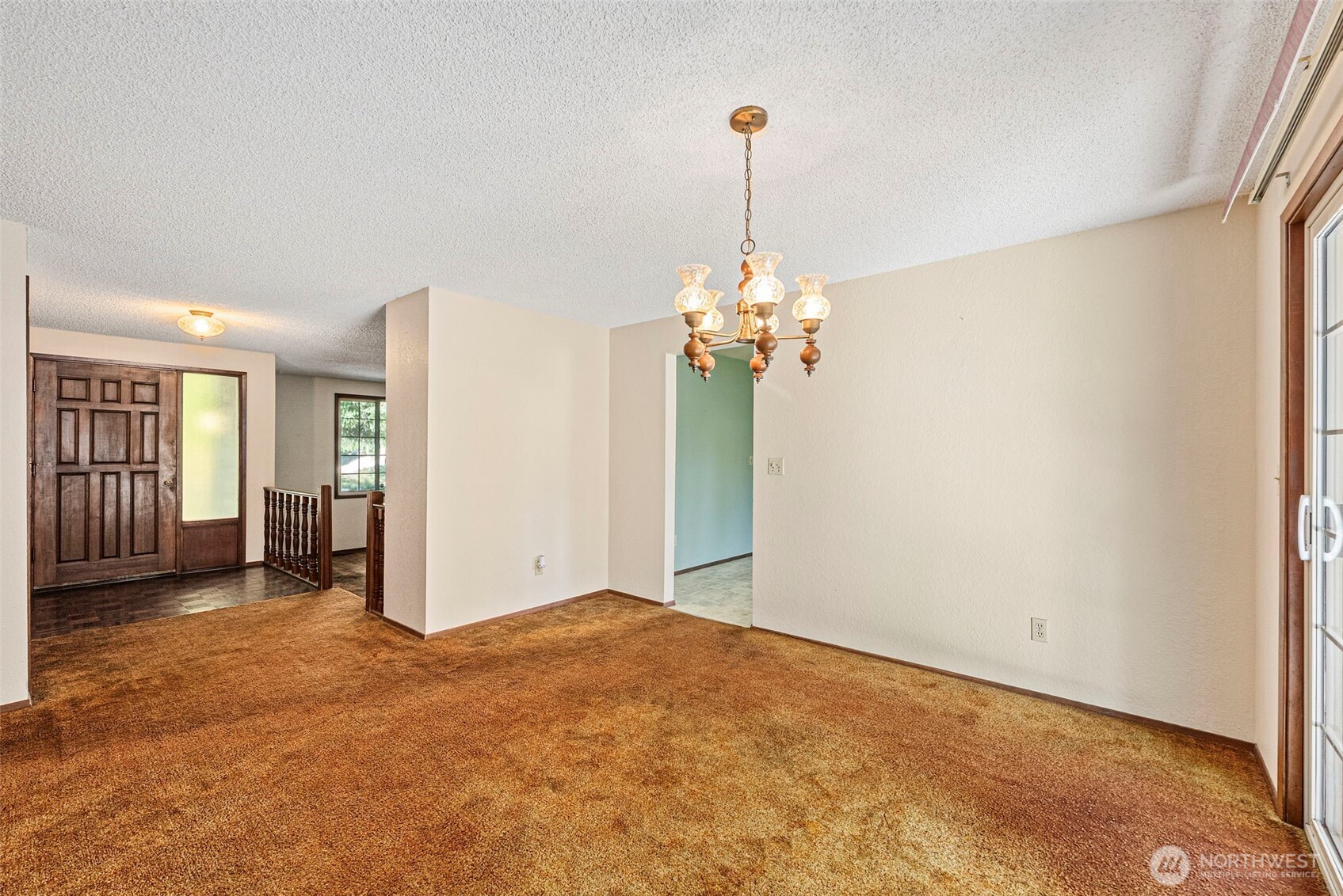 8112 266th Street East Graham, WA 98338 - Photo 10 of 40 a view of a room with a chandelier