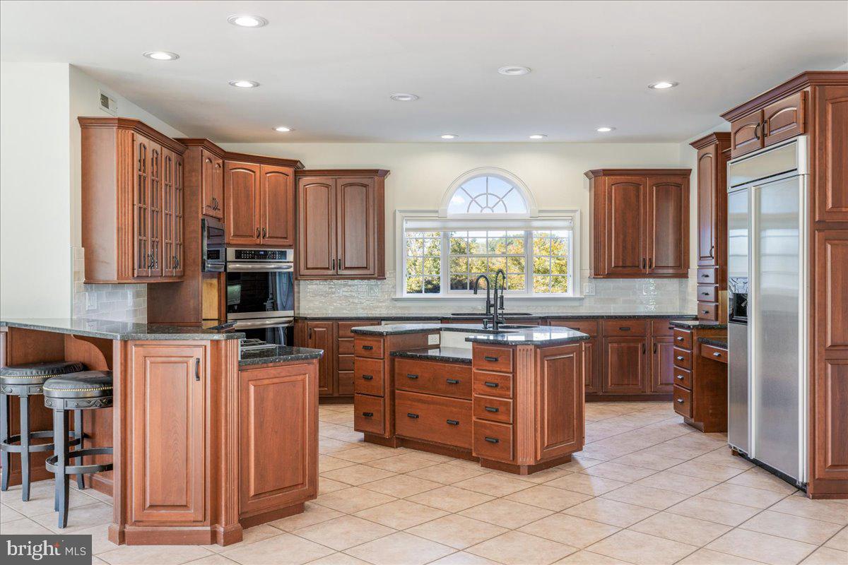 18 Todd Ridge Road Titusville, NJ 08560 - Photo 24 of 54 a kitchen with stainless steel appliances granite countertop a stove top oven a sink and a refrigerator