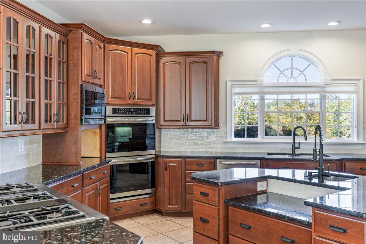 18 Todd Ridge Road Titusville, NJ 08560 - Photo 25 of 54 a kitchen with a stove a sink and a microwave