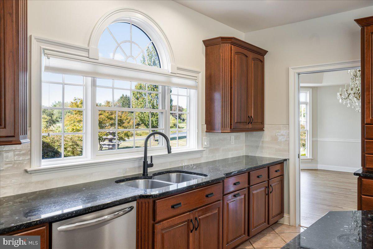 18 Todd Ridge Road Titusville, NJ 08560 - Photo 27 of 54 a kitchen with stainless steel appliances granite countertop a sink a stove and a wooden cabinets