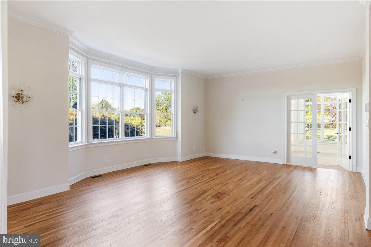 18 Todd Ridge Road Titusville, NJ 08560 - Photo 7 of 54 a view of an empty room with wooden floor and a window