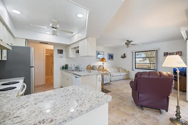 a view of a livingroom with furniture and window