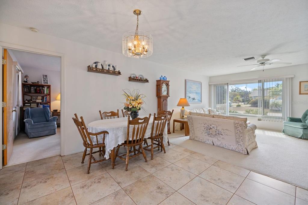 420 Duke Road Venice, FL 34293 - Photo 16 of 31 a view of a dining room and hall with furniture