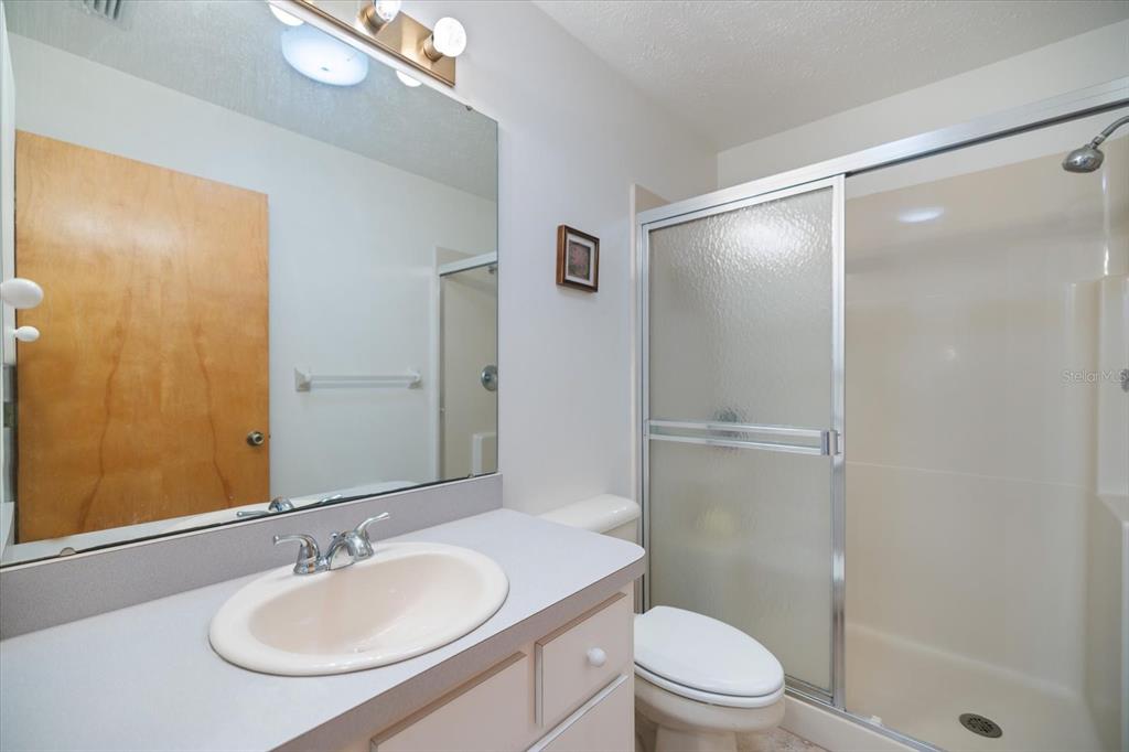 420 Duke Road Venice, FL 34293 - Photo 20 of 31 a bathroom with a sink toilet and shower