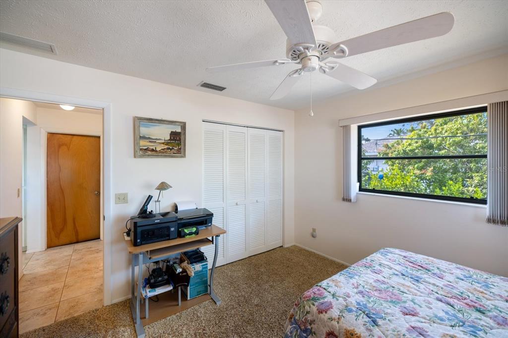 420 Duke Road Venice, FL 34293 - Photo 22 of 31 a bedroom with a bed and a window