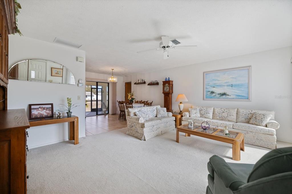 420 Duke Road Venice, FL 34293 - Photo 7 of 31 a living room with furniture and a couch