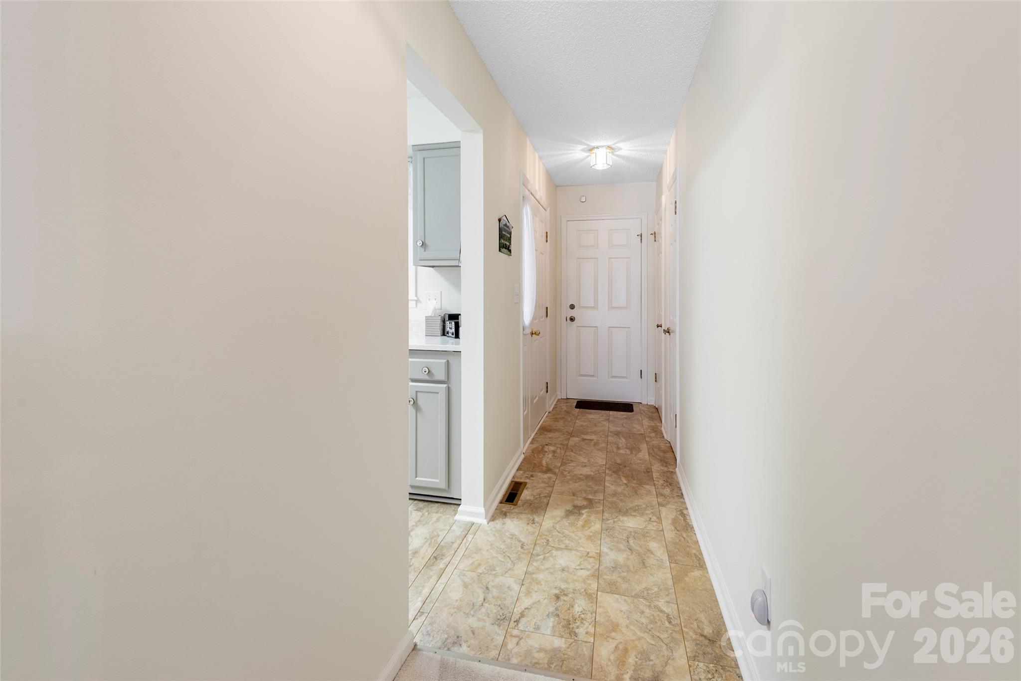 116 Lakeview Court Brevard, NC 28712 - Photo 12 of 43 a view of a hallway with wooden floor and a bathroom
