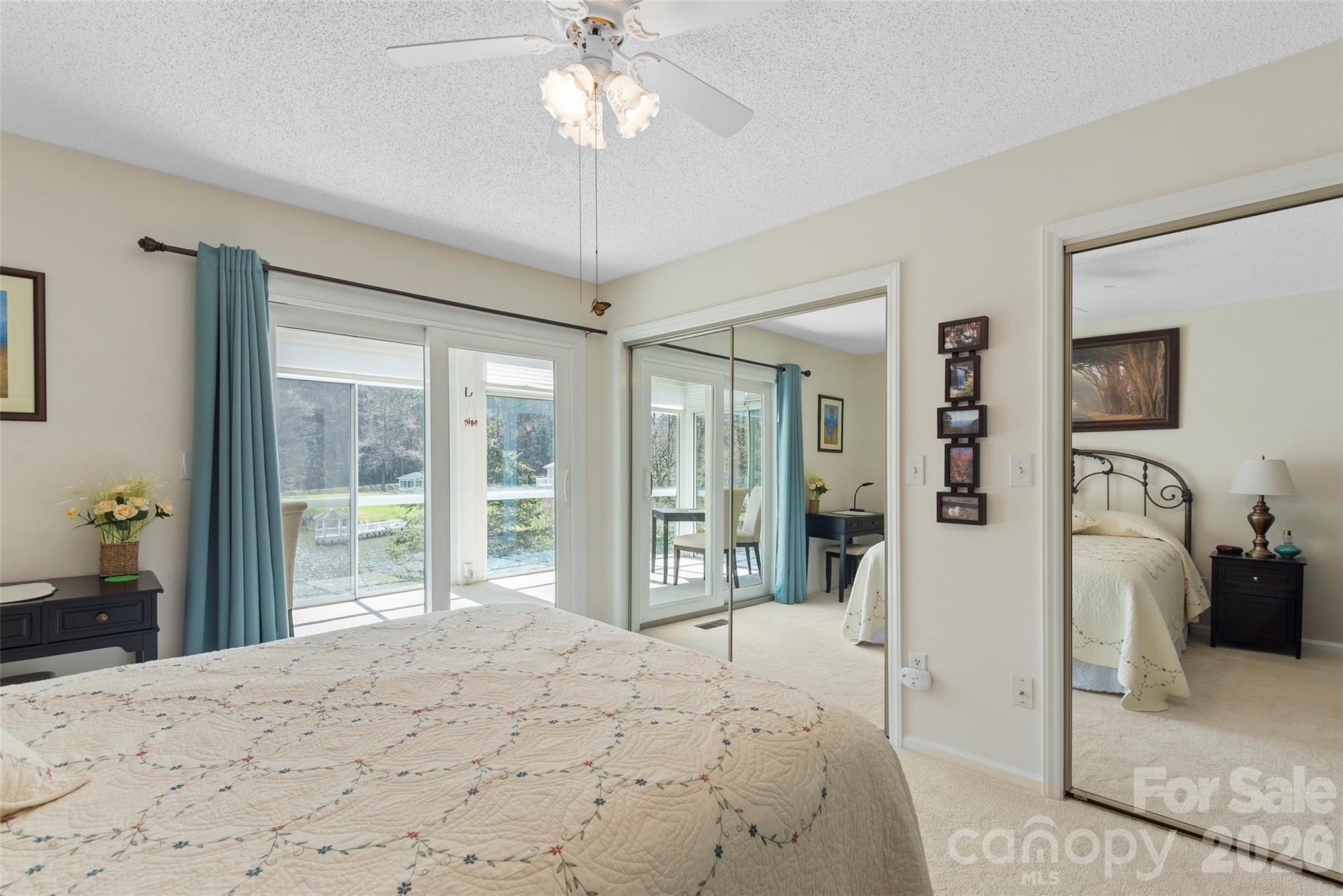 116 Lakeview Court Brevard, NC 28712 - Photo 14 of 43 a bedroom with a large bed and a flat tv screen