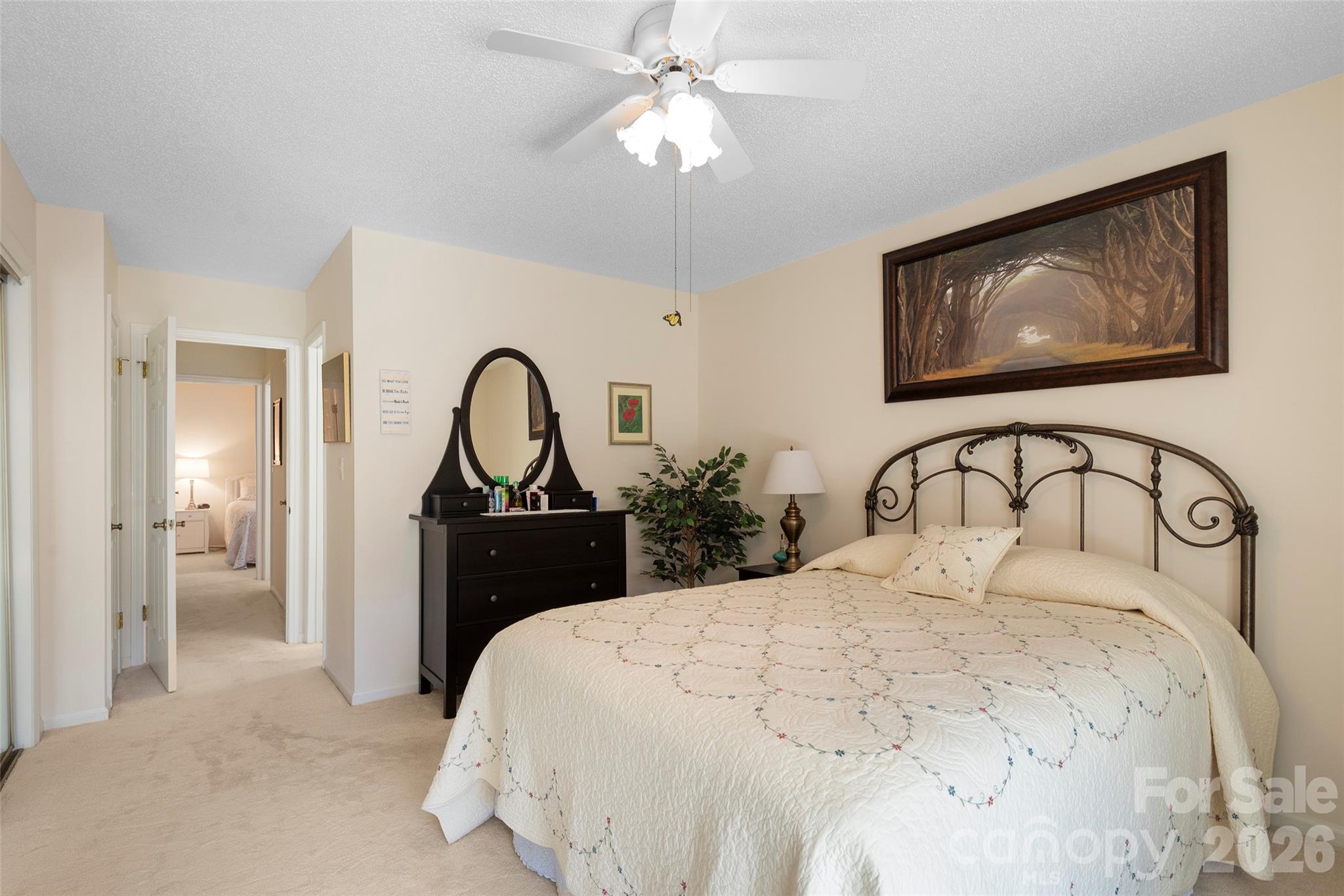 116 Lakeview Court Brevard, NC 28712 - Photo 15 of 43 a bedroom with a bed and a chandelier