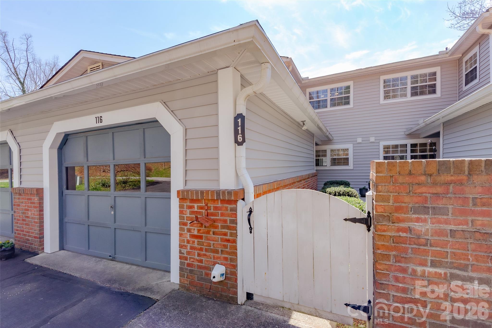 116 Lakeview Court Brevard, NC 28712 - Photo 2 of 43 a view of front of house with large windows