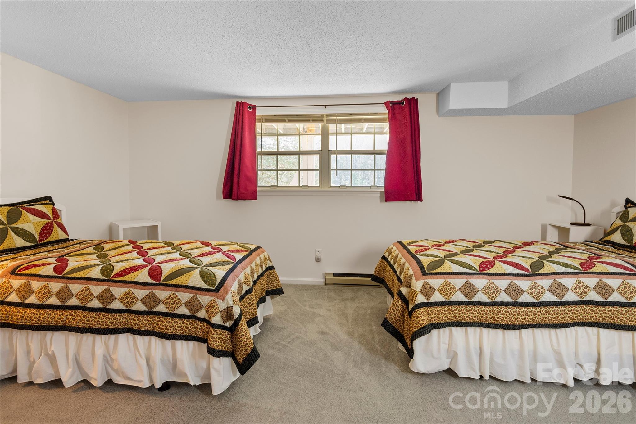 116 Lakeview Court Brevard, NC 28712 - Photo 25 of 43 a bedroom with a bed and window