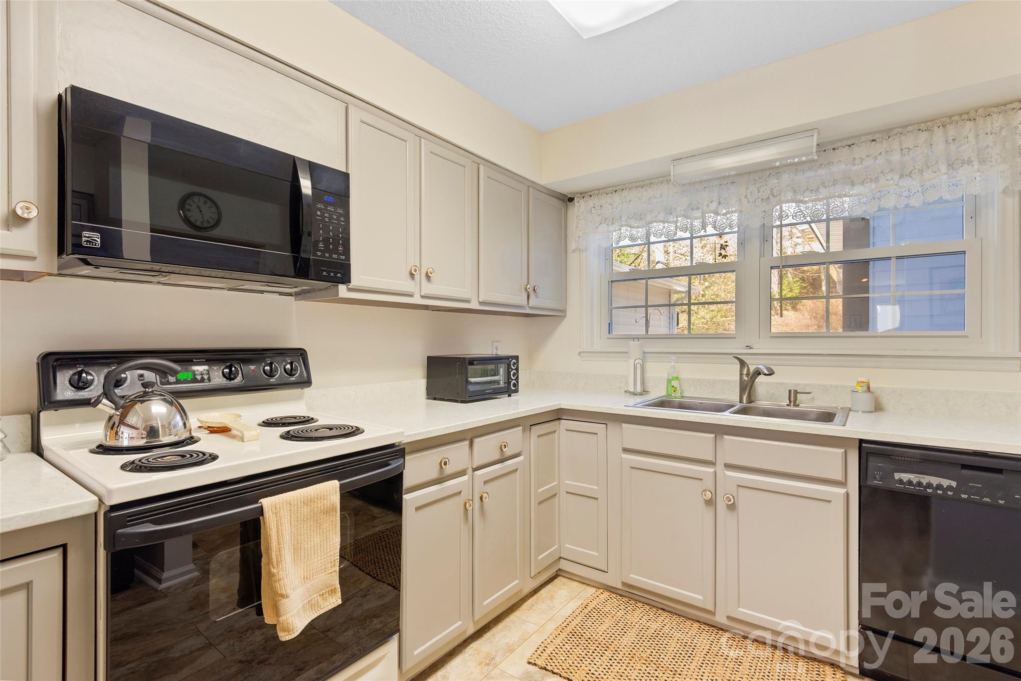 116 Lakeview Court Brevard, NC 28712 - Photo 5 of 43 a kitchen with stainless steel appliances a sink stove and microwave