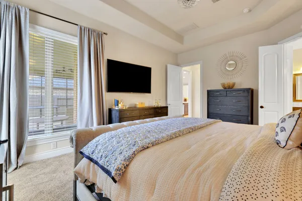 a bathroom with a tub sink shower and mirror