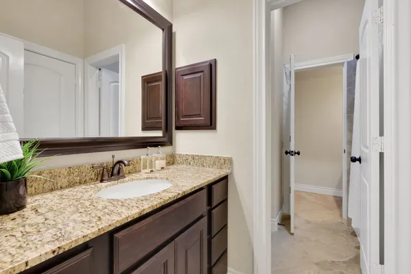 a view of a bathroom from a hallway