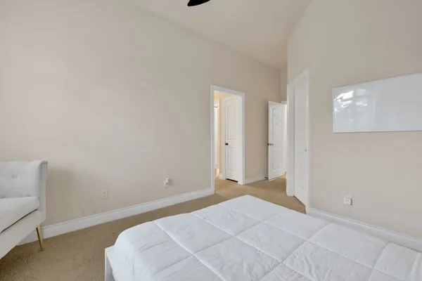 a bathroom with a granite countertop sink and a mirror with toilet