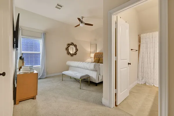 a bedroom with a bed and couch