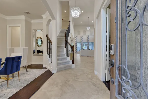 a view of an entryway with wooden floor