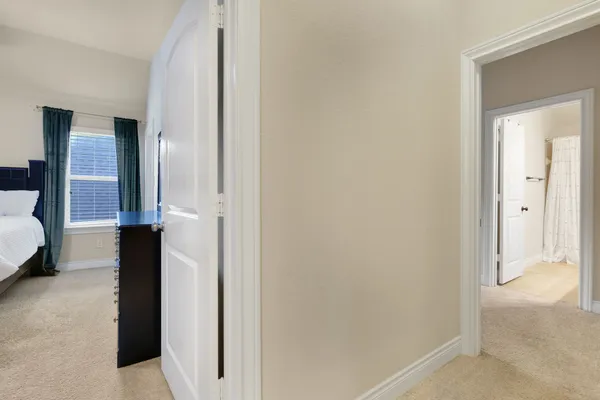 a view of a bedroom with a tub and bathroom