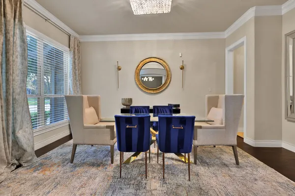 a living room with furniture a rug and a window