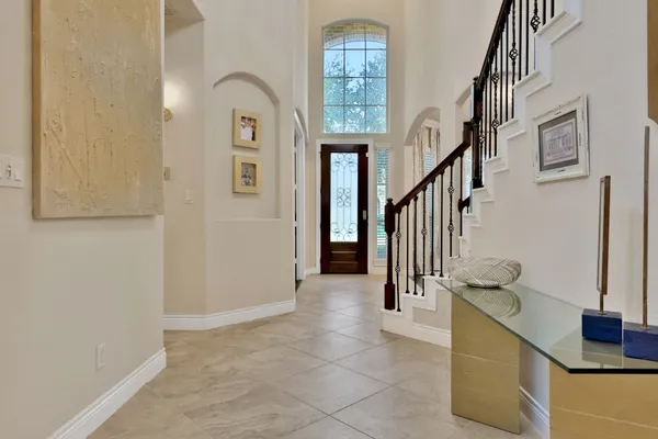 a view of entryway and hall with wooden floor