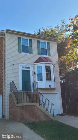 a front view of a house with yard