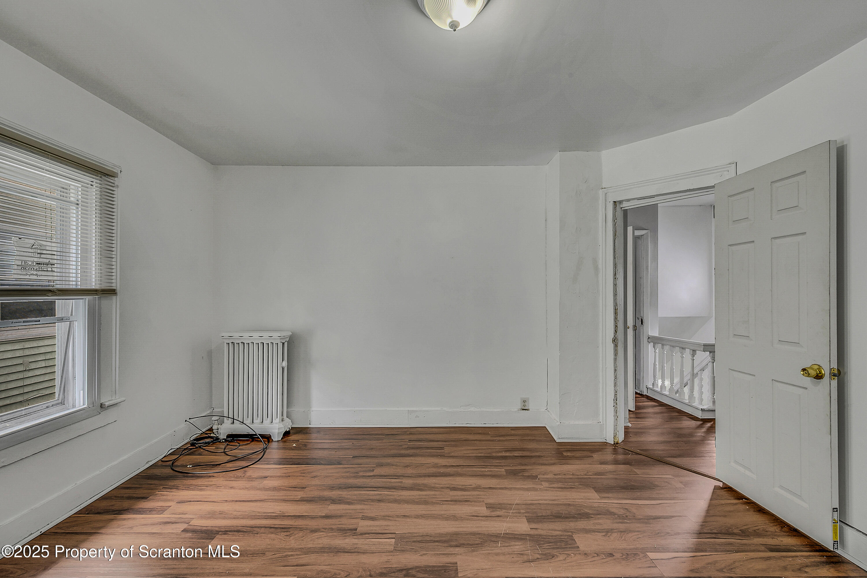 2528 Boulevard Avenue, Unit 2 Scranton, PA 18509 - Photo 11 of 18 a view of empty room with wooden floor and fan