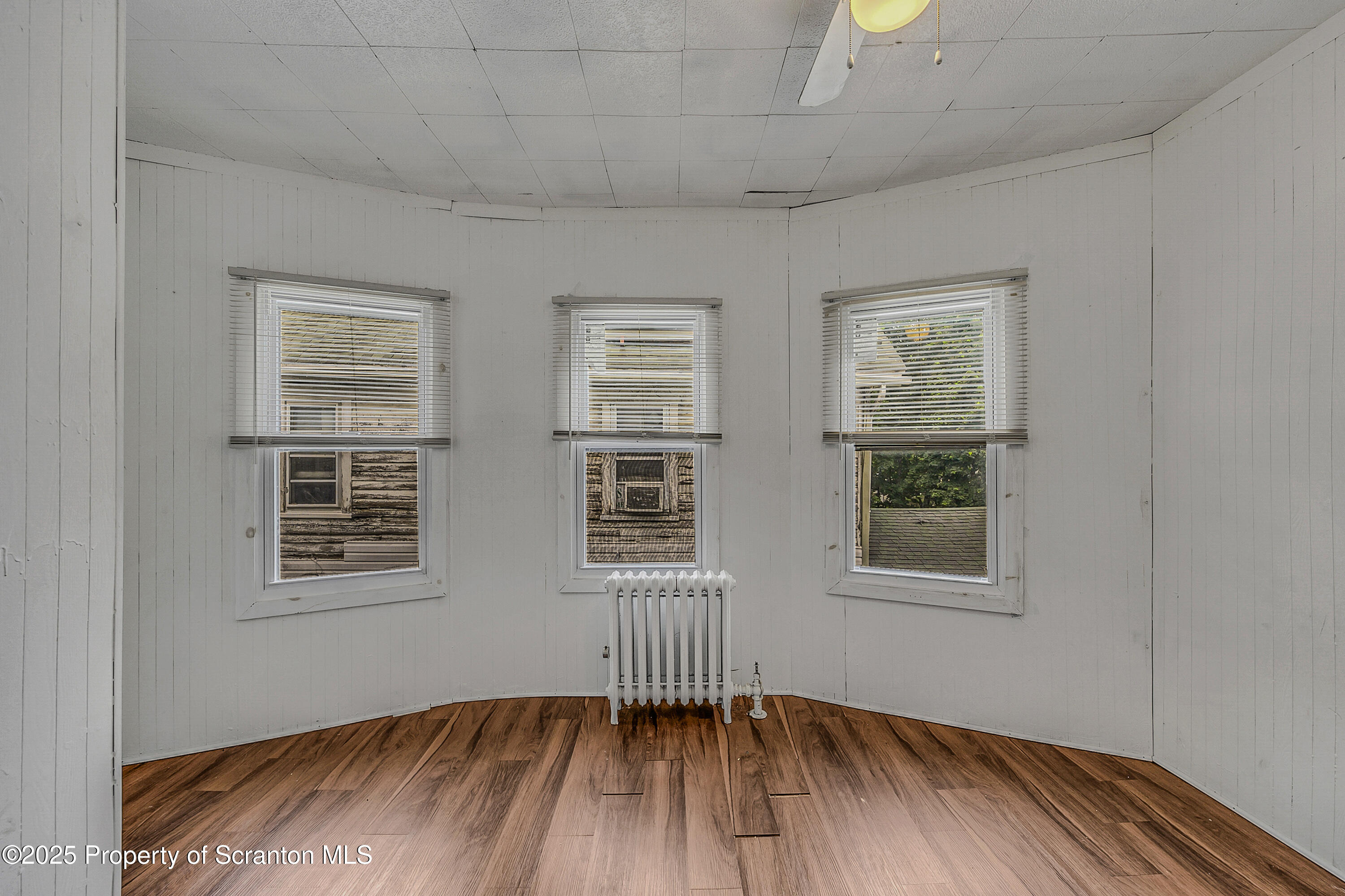2528 Boulevard Avenue, Unit 2 Scranton, PA 18509 - Photo 12 of 18 a view of an empty room with wooden floor and a window