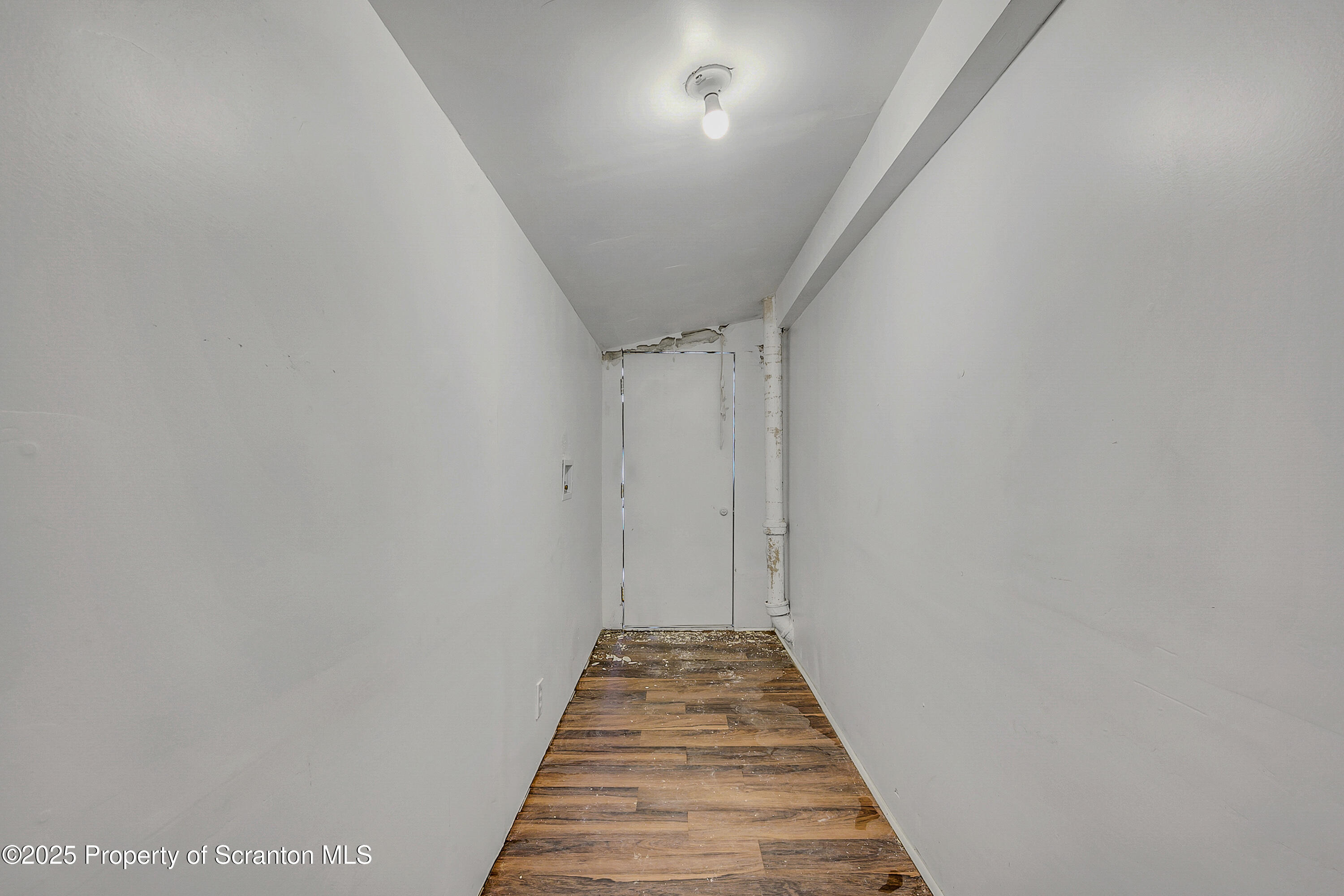 2528 Boulevard Avenue, Unit 2 Scranton, PA 18509 - Photo 15 of 18 a view of a hallway with wooden floor and staircase