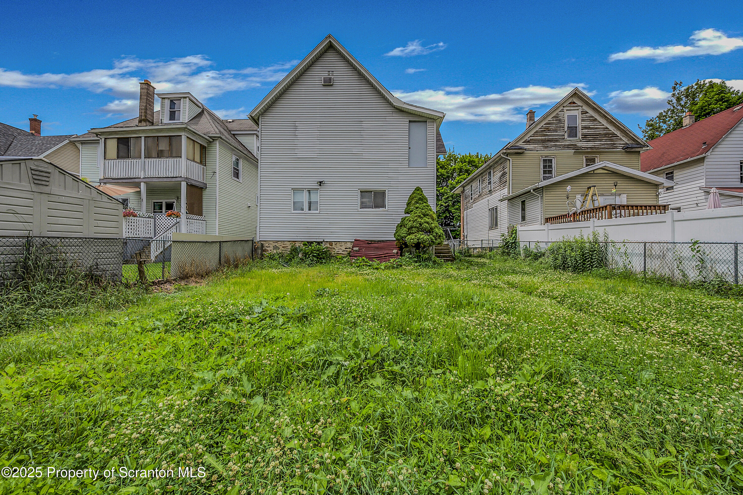 2528 Boulevard Avenue, Unit 2 Scranton, PA 18509 - Photo 18 of 18 a front view of a house with a yard and garage