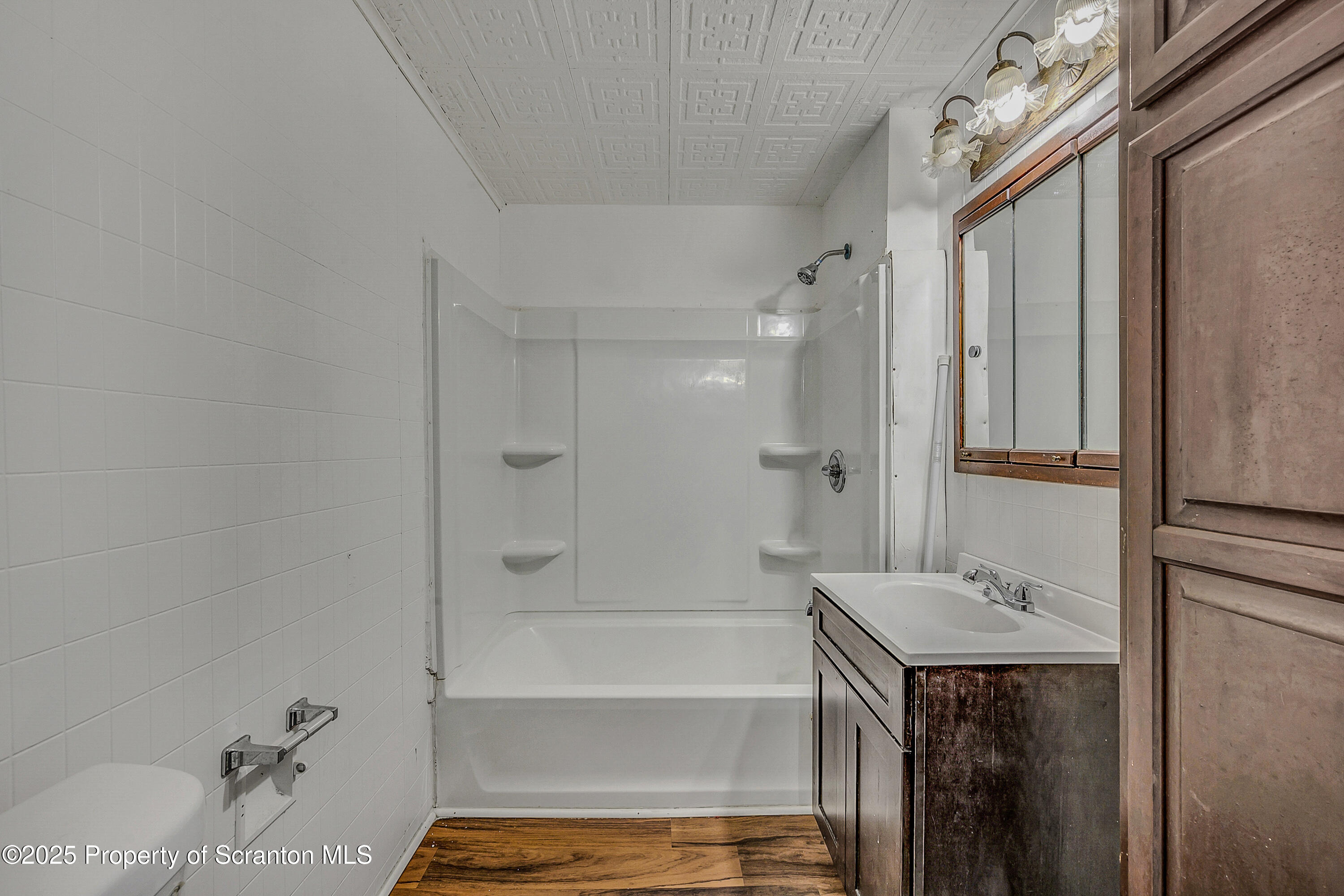 2528 Boulevard Avenue, Unit 2 Scranton, PA 18509 - Photo 6 of 18 a bathroom with a bathtub and a shower