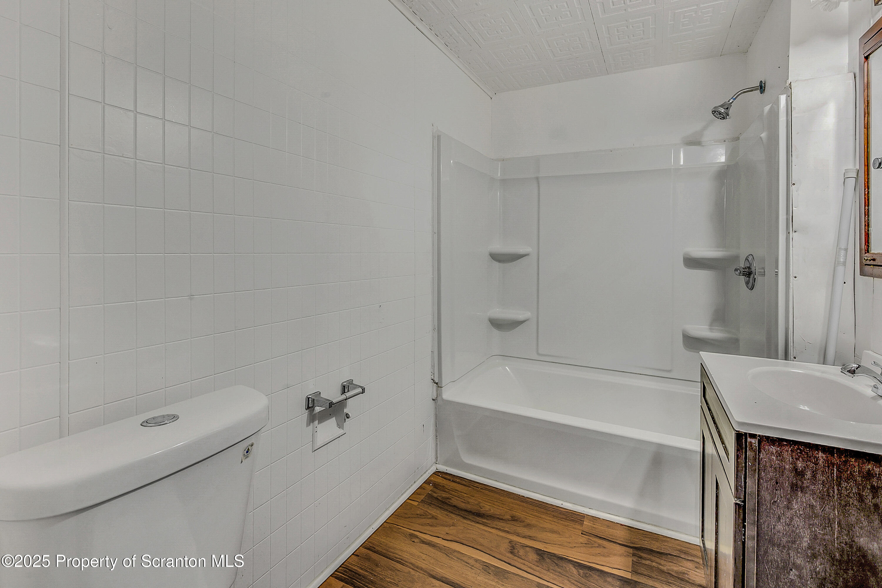 2528 Boulevard Avenue, Unit 2 Scranton, PA 18509 - Photo 7 of 18 a bathroom with a bathtub and a shower