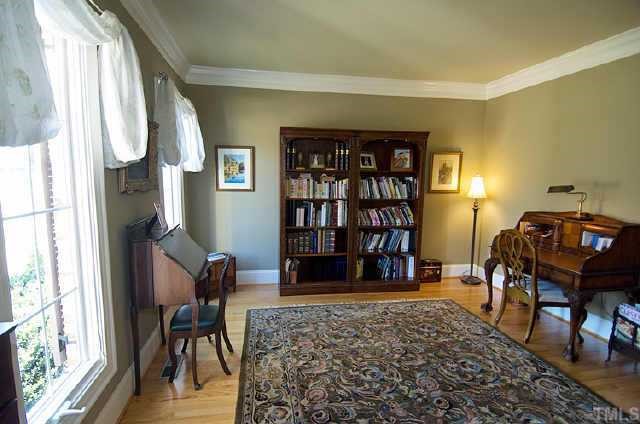 12433 Bayleaf Church Road Raleigh, NC 27614 - Photo 3 of 12 a living room with furniture and a book shelf