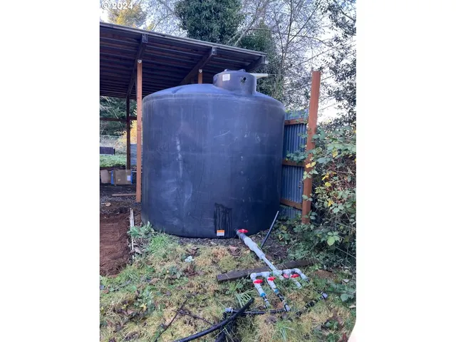 a view of a back yard of the house