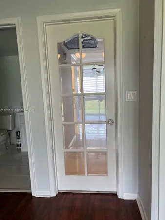 a bathroom with a glass shower door