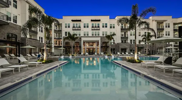a view of swimming pool with outdoor seating