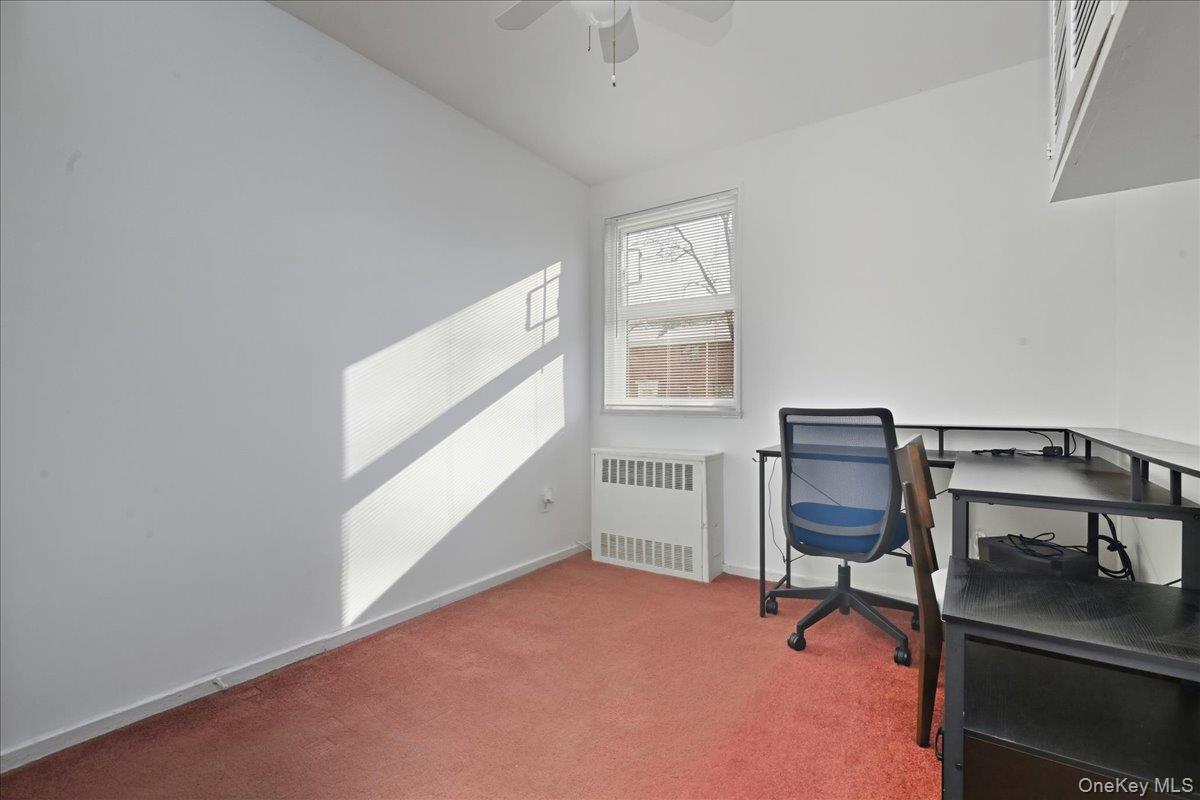 218-03 68th Avenue, Unit 1 Queens, NY 11364 - Photo 10 of 13 Office space with radiator and carpet floors