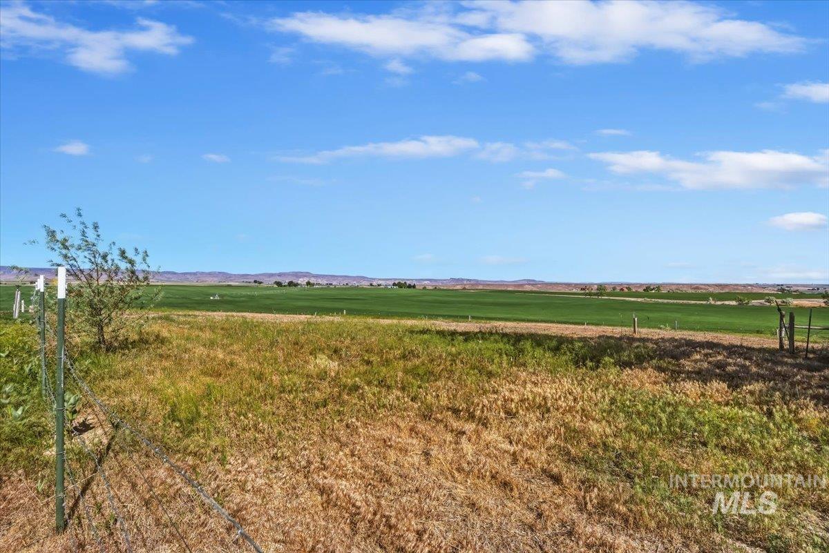2331 Gulley Road Homedale, ID 83628 - Photo 42 of 46 Expansive field with a distant mountain range and a clear blue sky