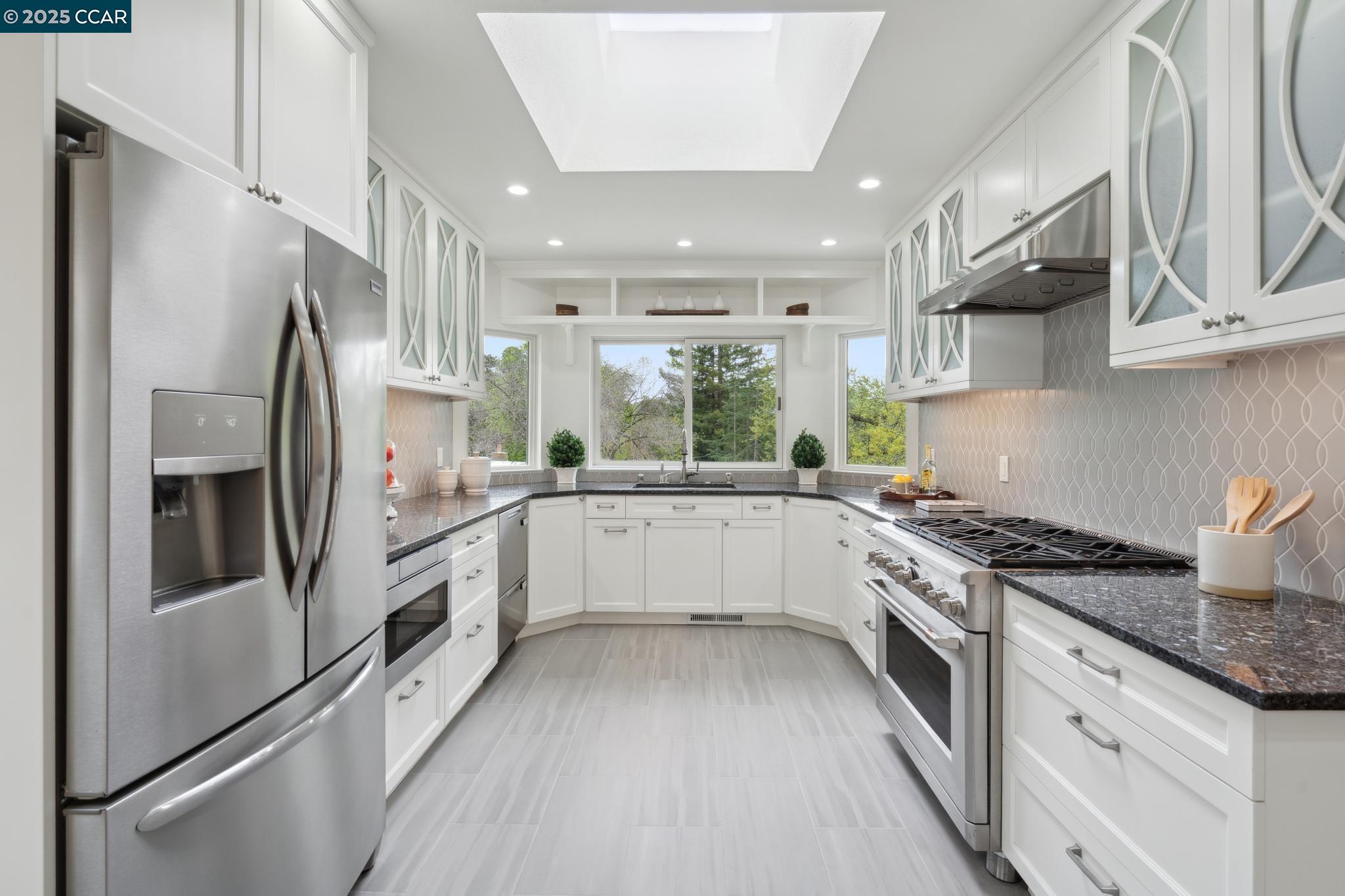 3555 Old Mountain View Drive Lafayette, CA 94549 - Photo 16 of 41 a kitchen with stainless steel appliances granite countertop a refrigerator sink and stove