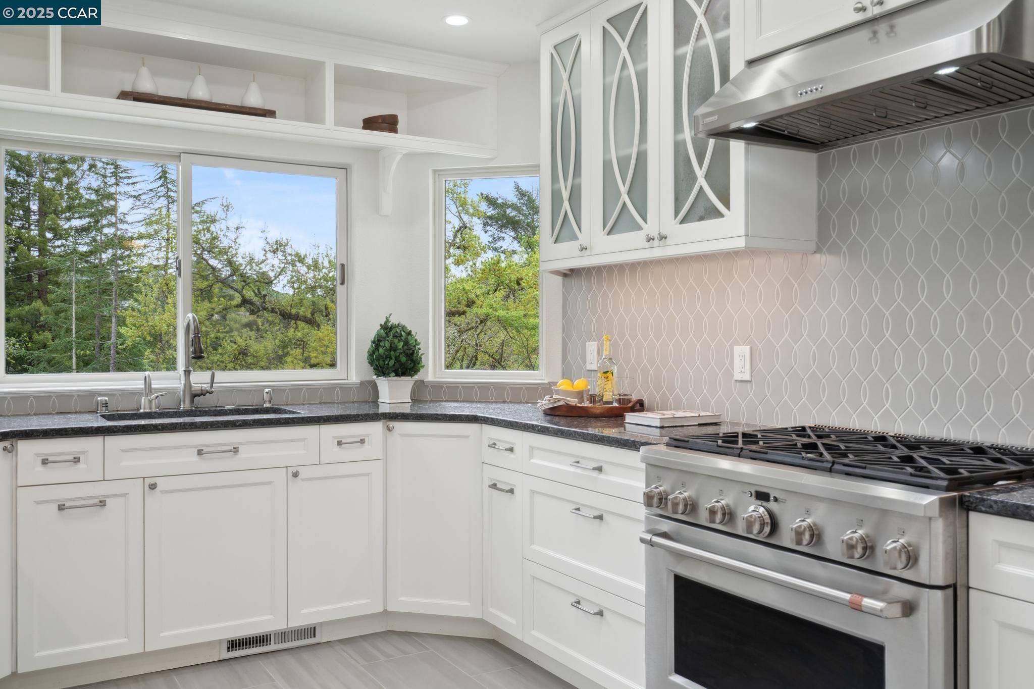 3555 Old Mountain View Drive Lafayette, CA 94549 - Photo 18 of 41 a kitchen with white cabinets and appliances