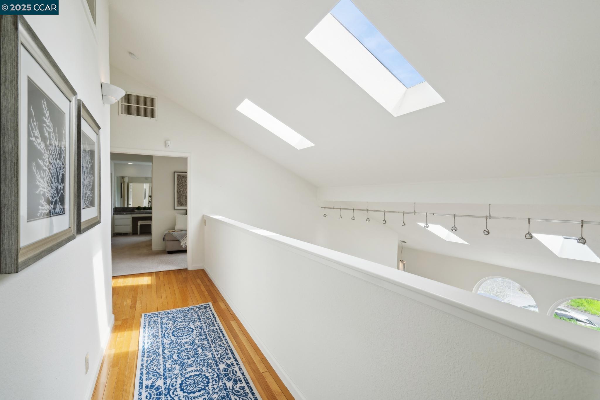 3555 Old Mountain View Drive Lafayette, CA 94549 - Photo 20 of 41 a view of a hallway with wooden floor and furniture