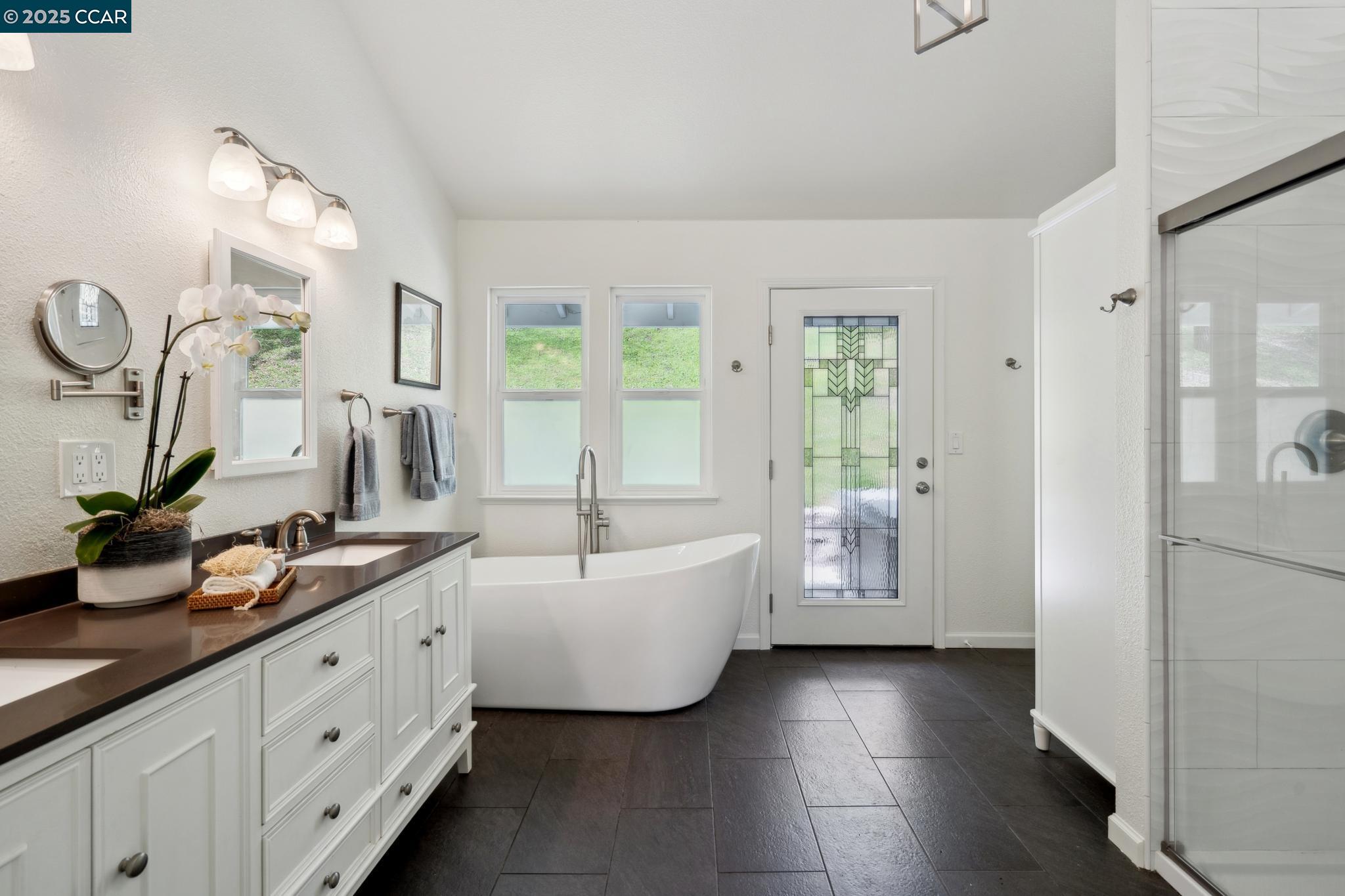 3555 Old Mountain View Drive Lafayette, CA 94549 - Photo 22 of 41 a spacious bathroom with a double vanity sink a mirror and a bathtub