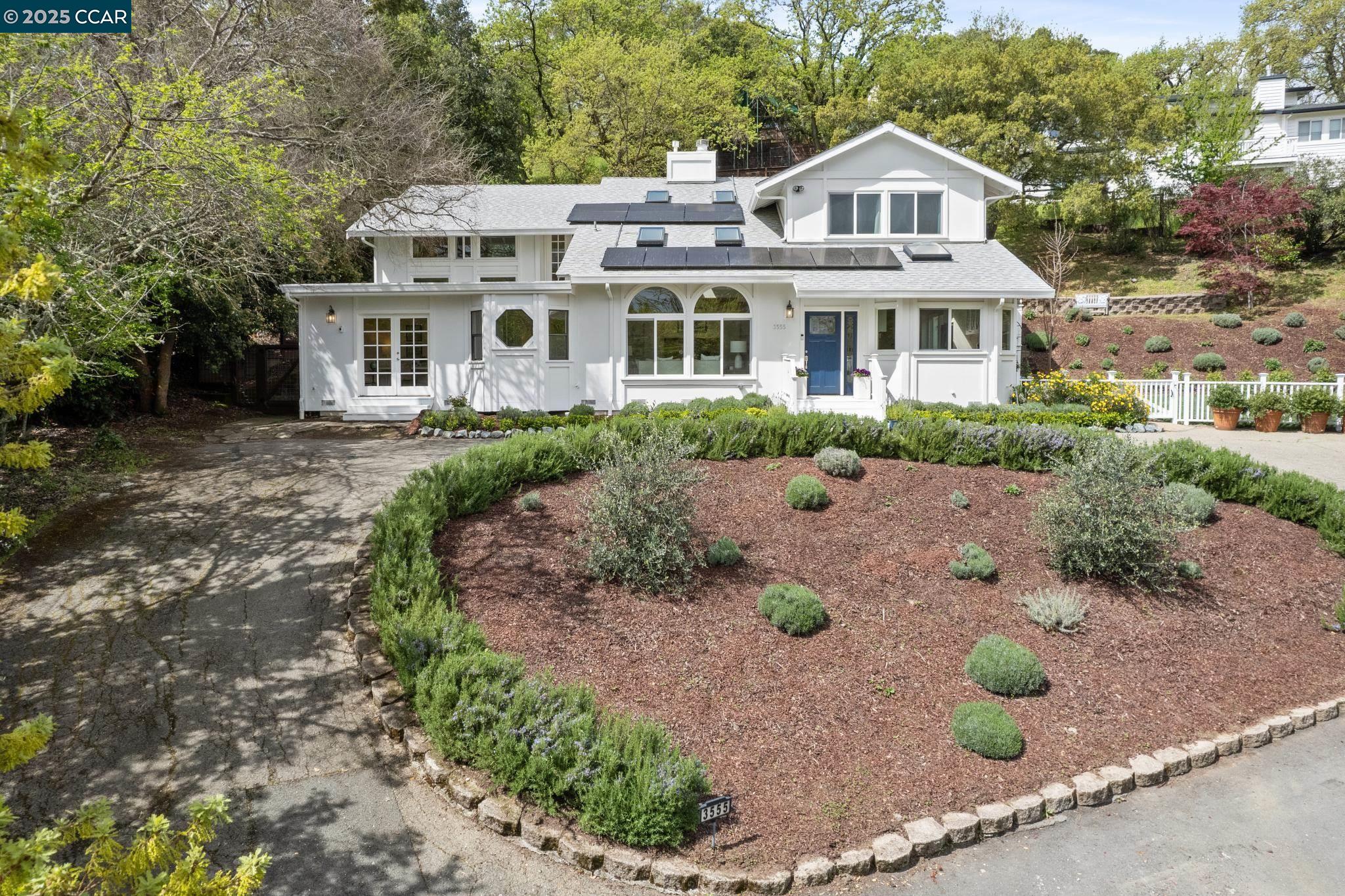 3555 Old Mountain View Drive Lafayette, CA 94549 - Photo 3 of 41 a view of a white house with a yard outdoor space and seating area