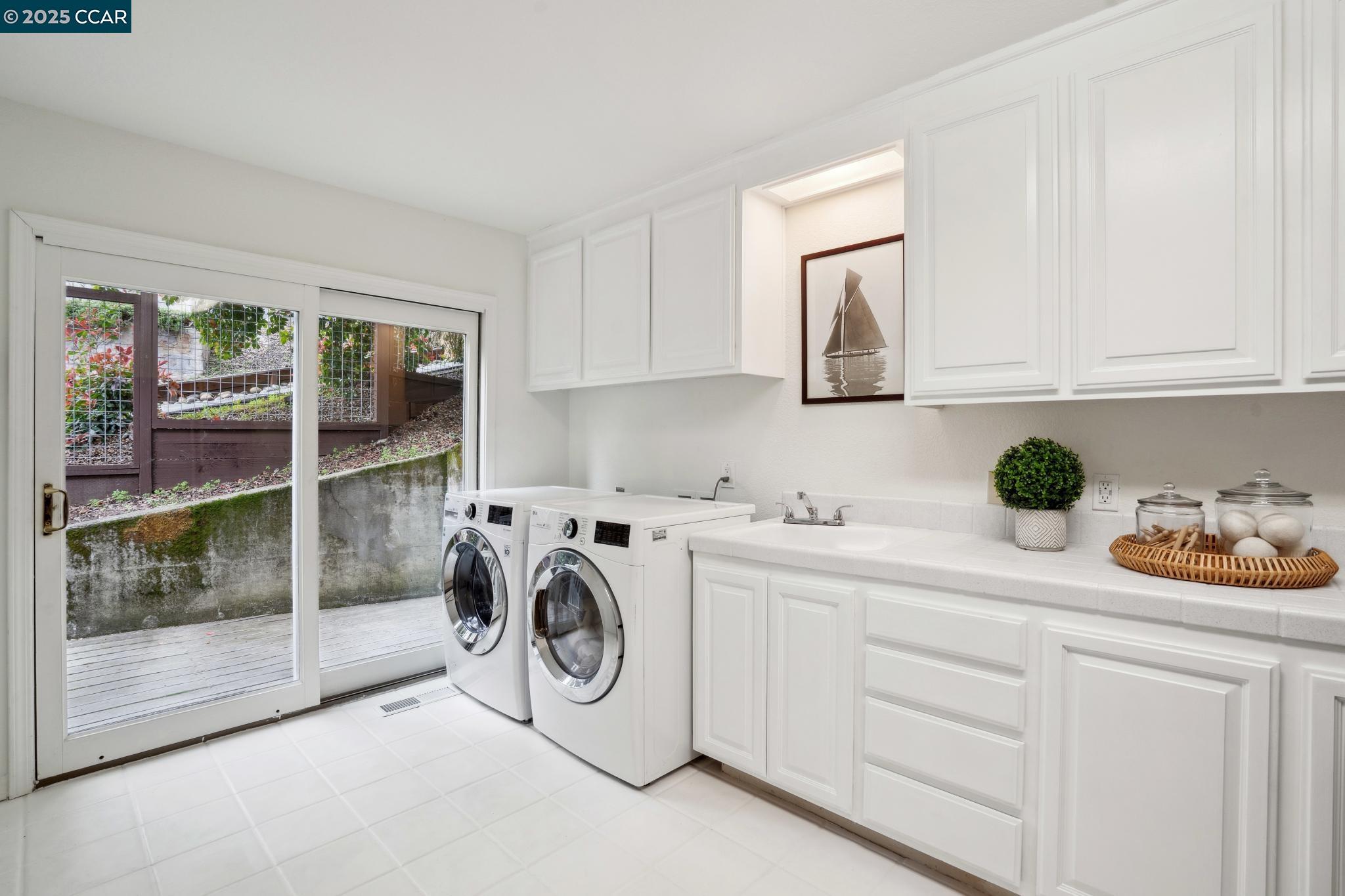 3555 Old Mountain View Drive Lafayette, CA 94549 - Photo 31 of 41 a utility room with sink dryer and washer