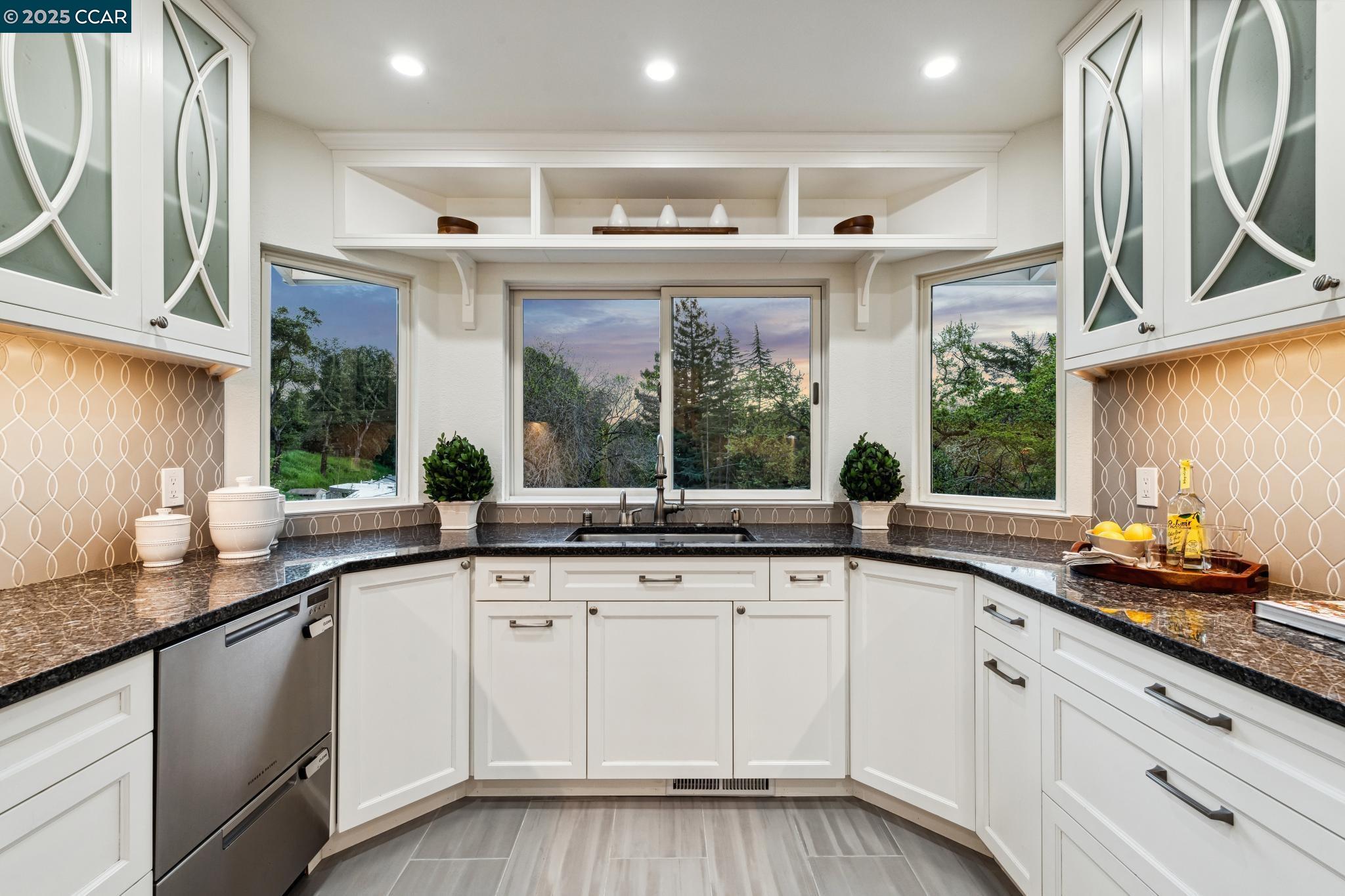 3555 Old Mountain View Drive Lafayette, CA 94549 - Photo 36 of 41 a kitchen with granite countertop a sink and white cabinets