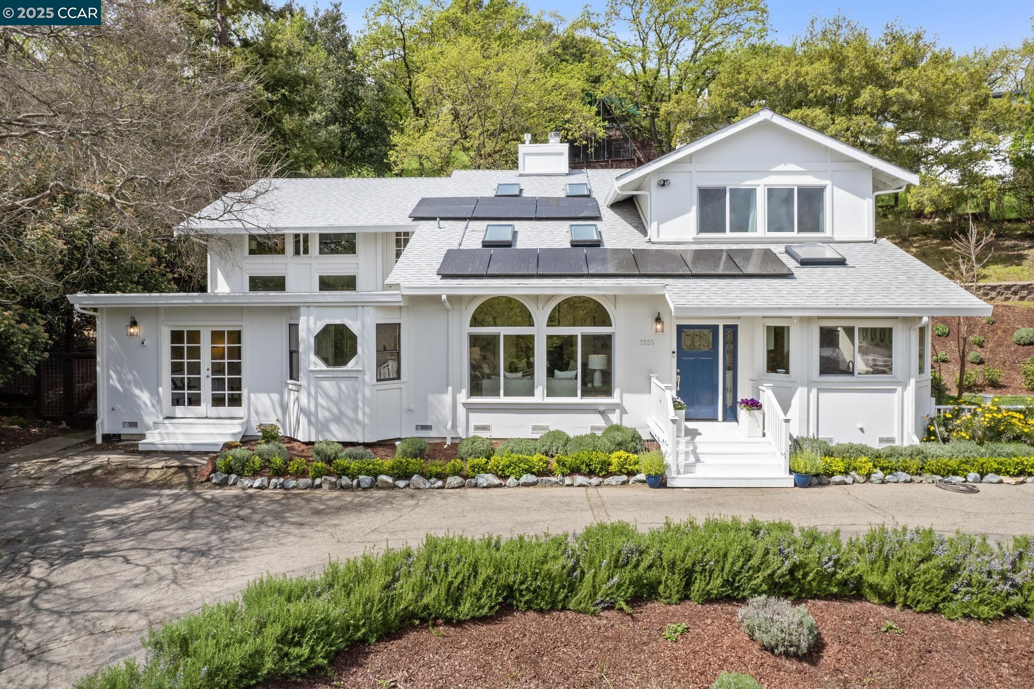 3555 Old Mountain View Drive Lafayette, CA 94549 - Photo 4 of 41 a front view of a house with a yard and trees