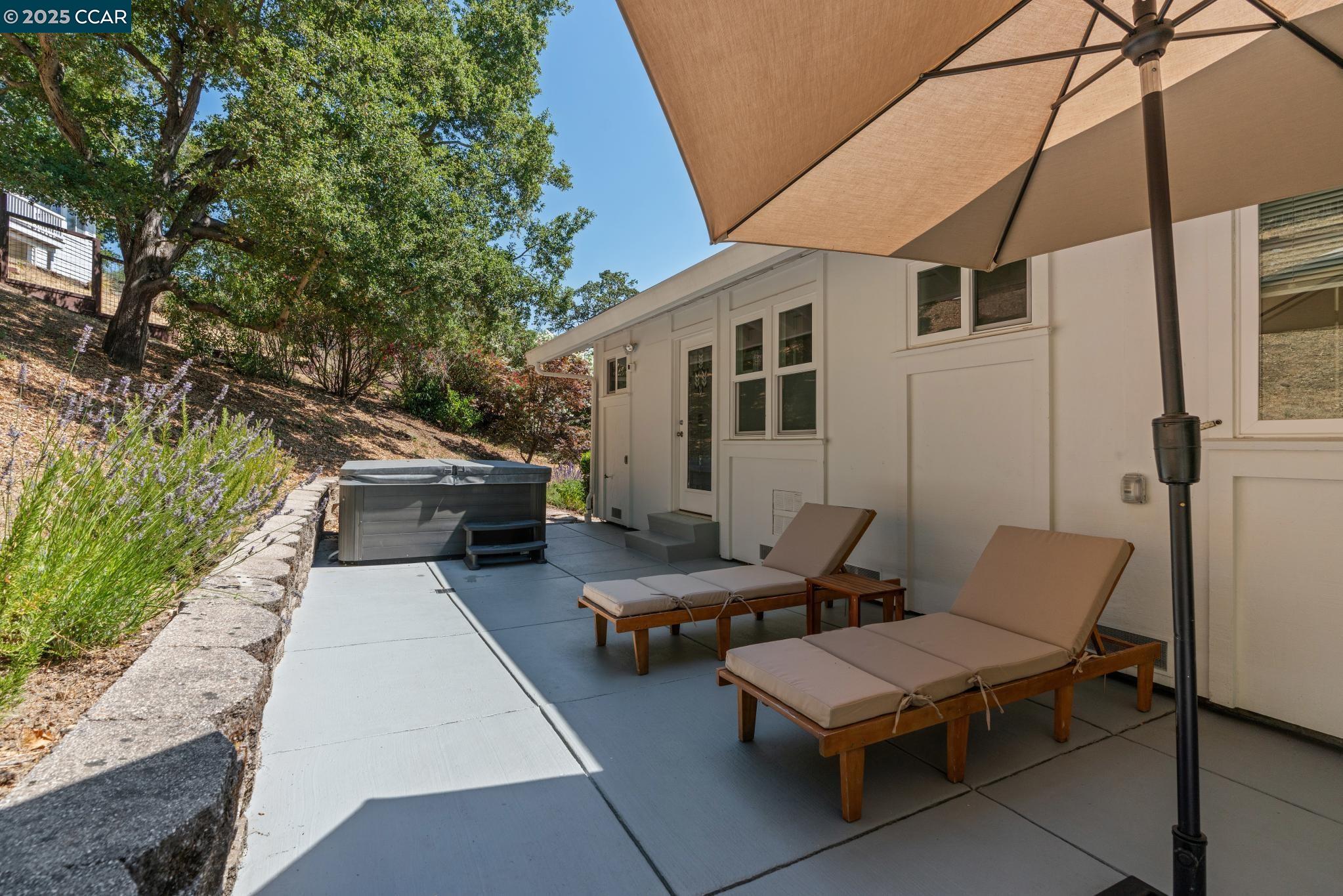 3555 Old Mountain View Drive Lafayette, CA 94549 - Photo 10 of 41 a view of a patio with table and chairs and potted plants